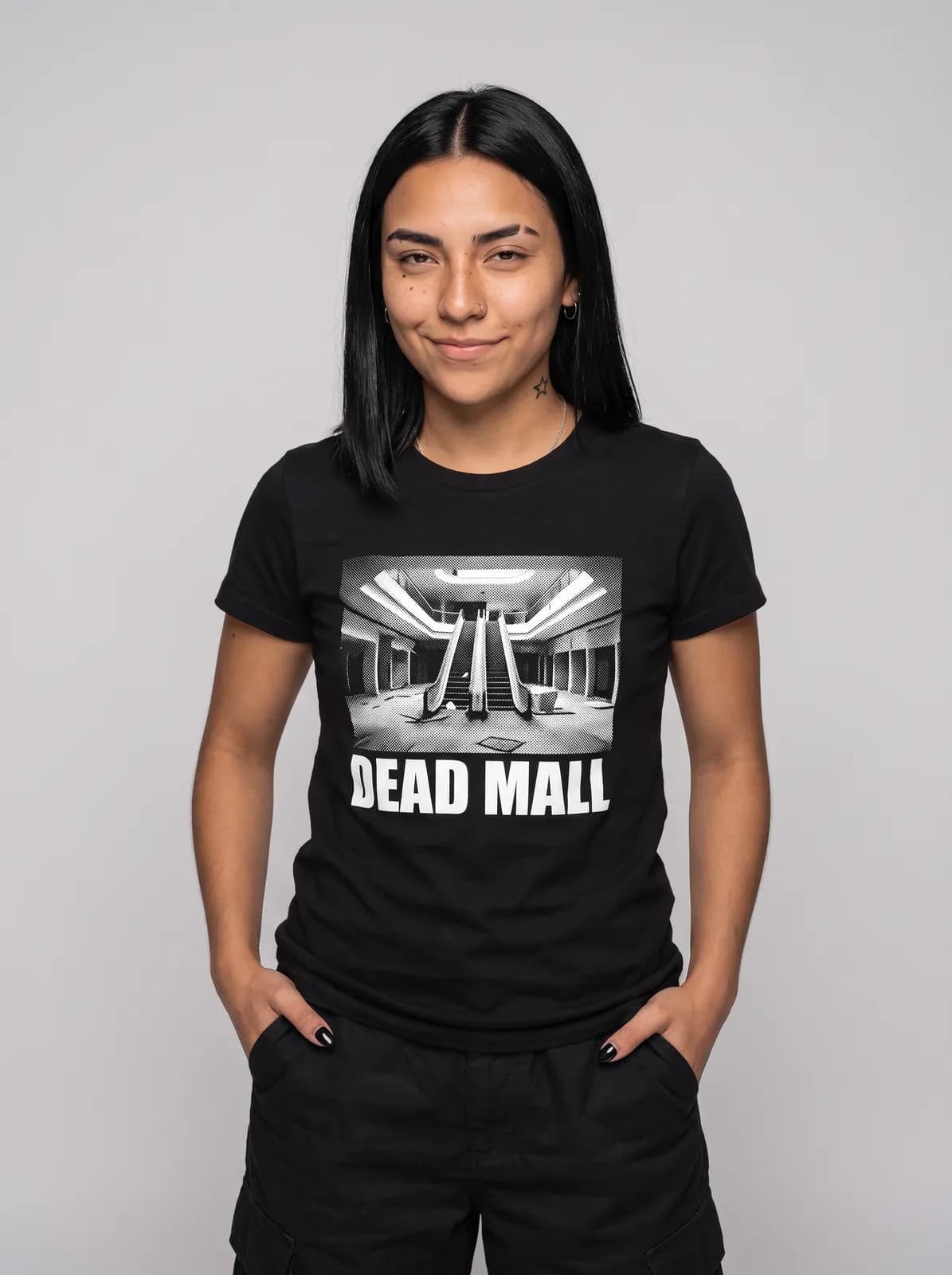 Nova Reyes wearing the DEAD MALL Tee in Black, waist up crop