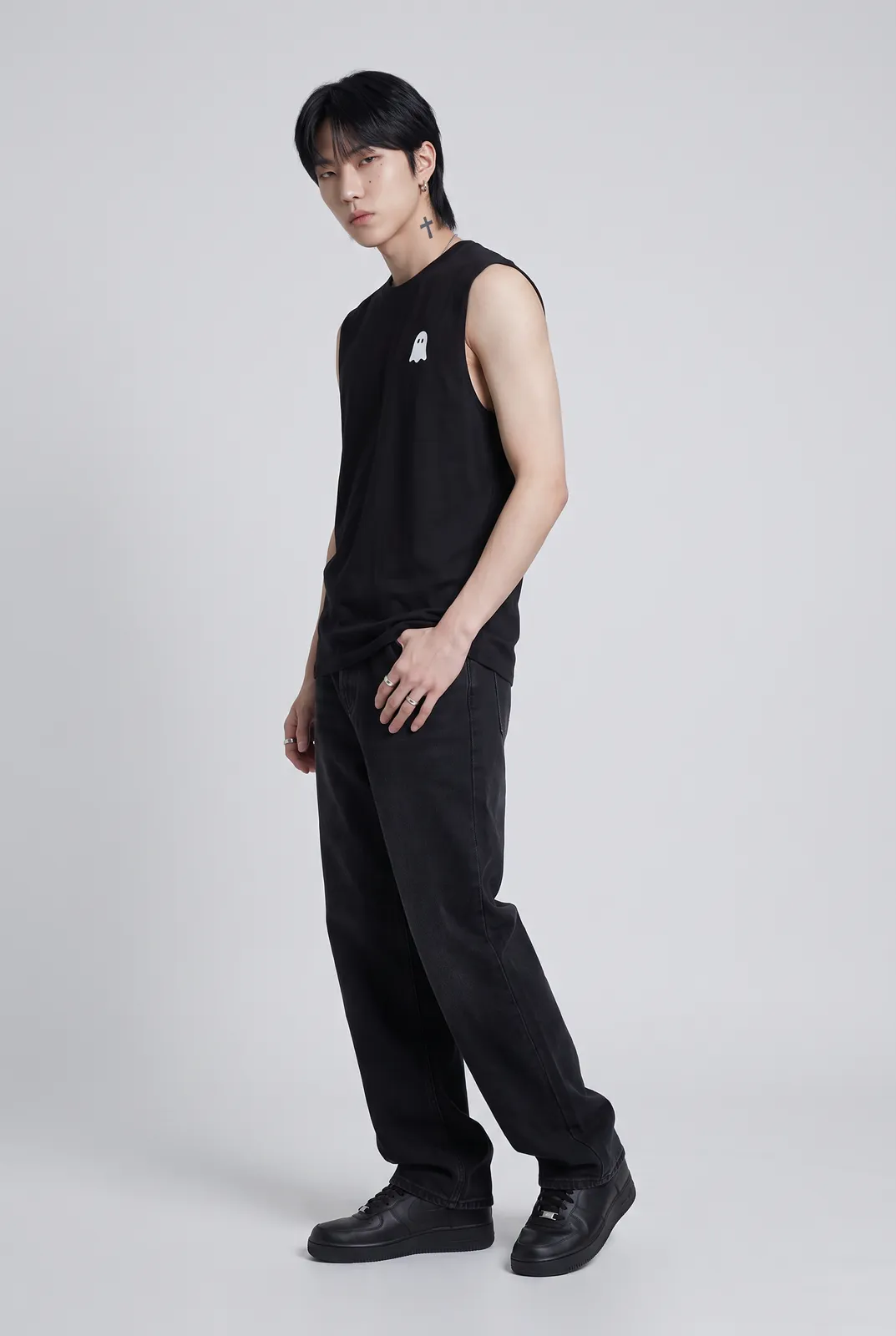 Jae Park wearing the GHOST Muscle Tee in Black, three quarter lean
