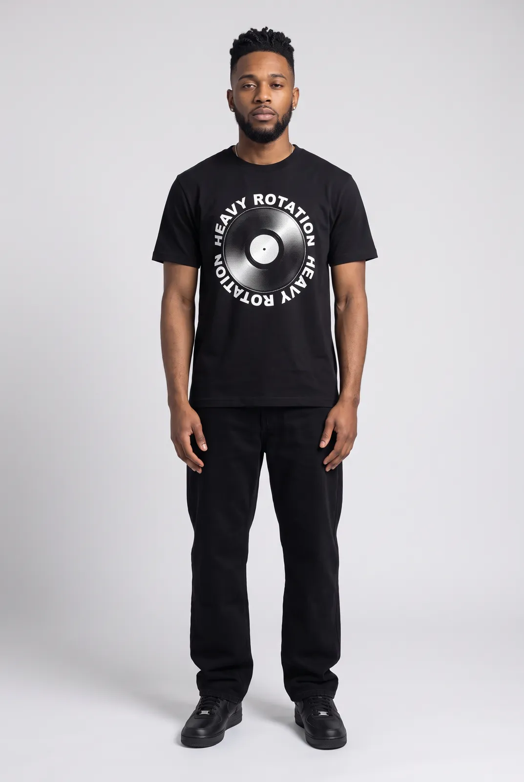 Malik Carter wearing the HEAVY ROTATION Tee in Black, front hero