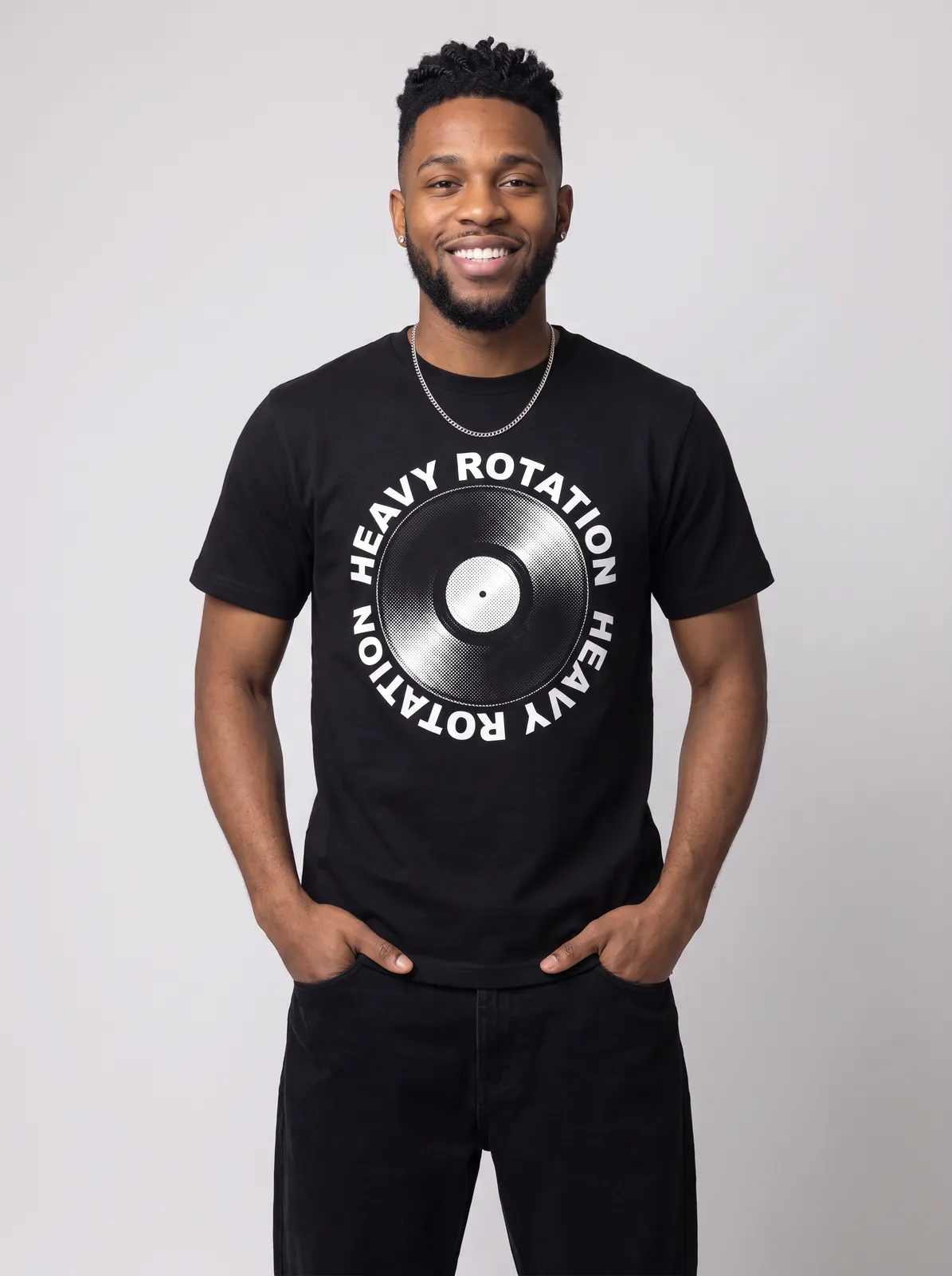 Malik Carter wearing the HEAVY ROTATION Tee in Black, waist up crop
