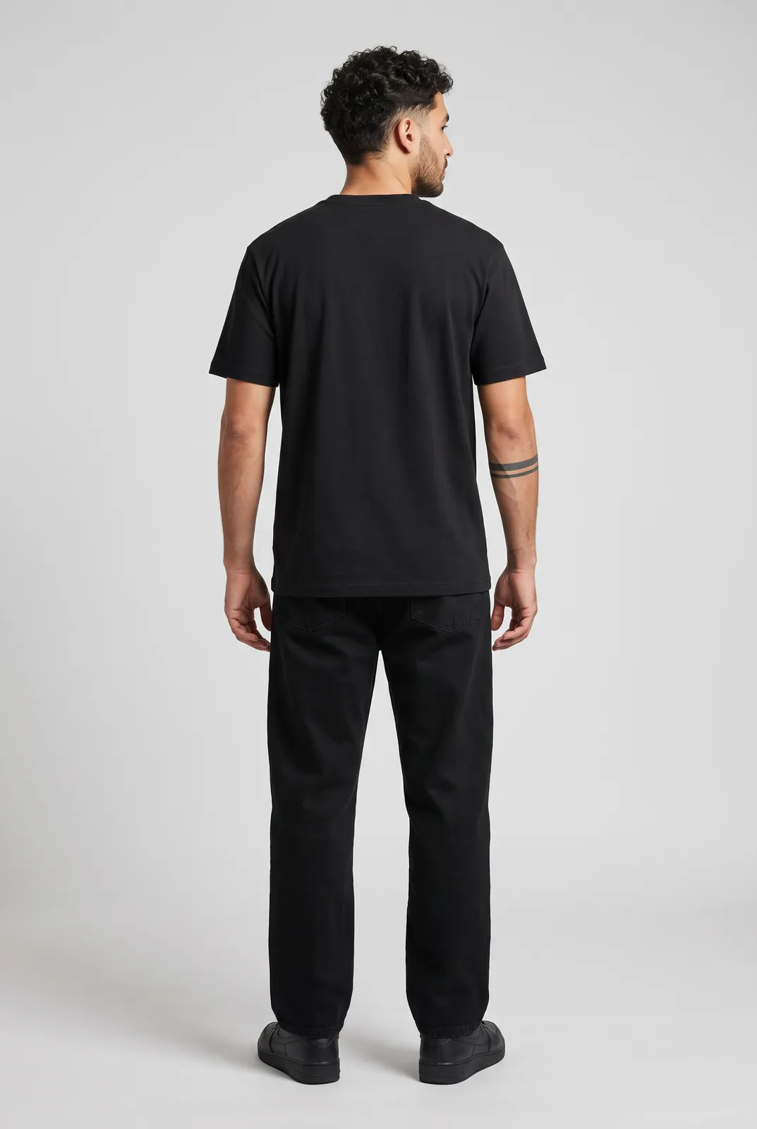Diego Alvarez wearing the OVERDRIVE Tee in Black, back turn