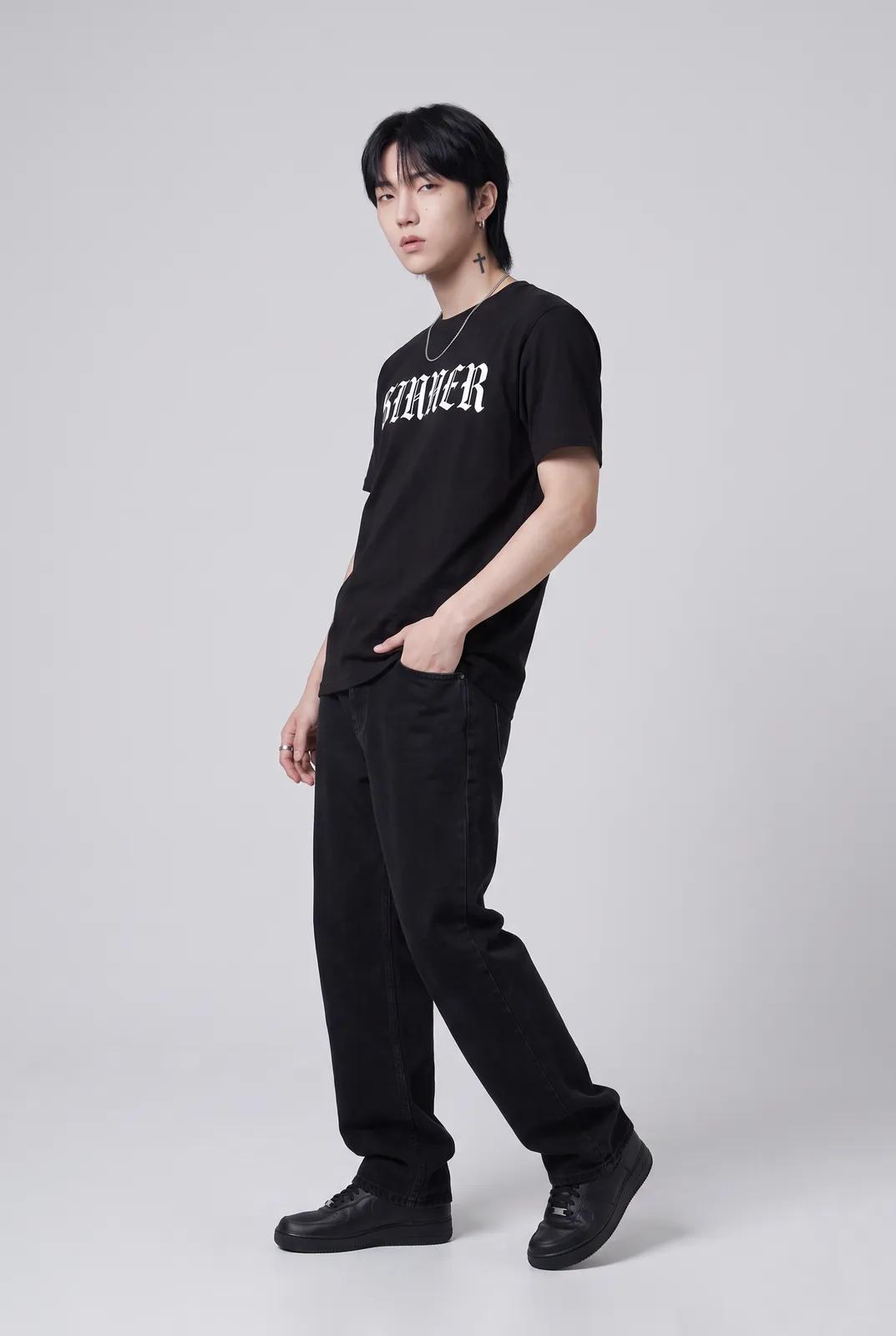 Jae Park wearing the SINNER Tee in Black, three quarter lean