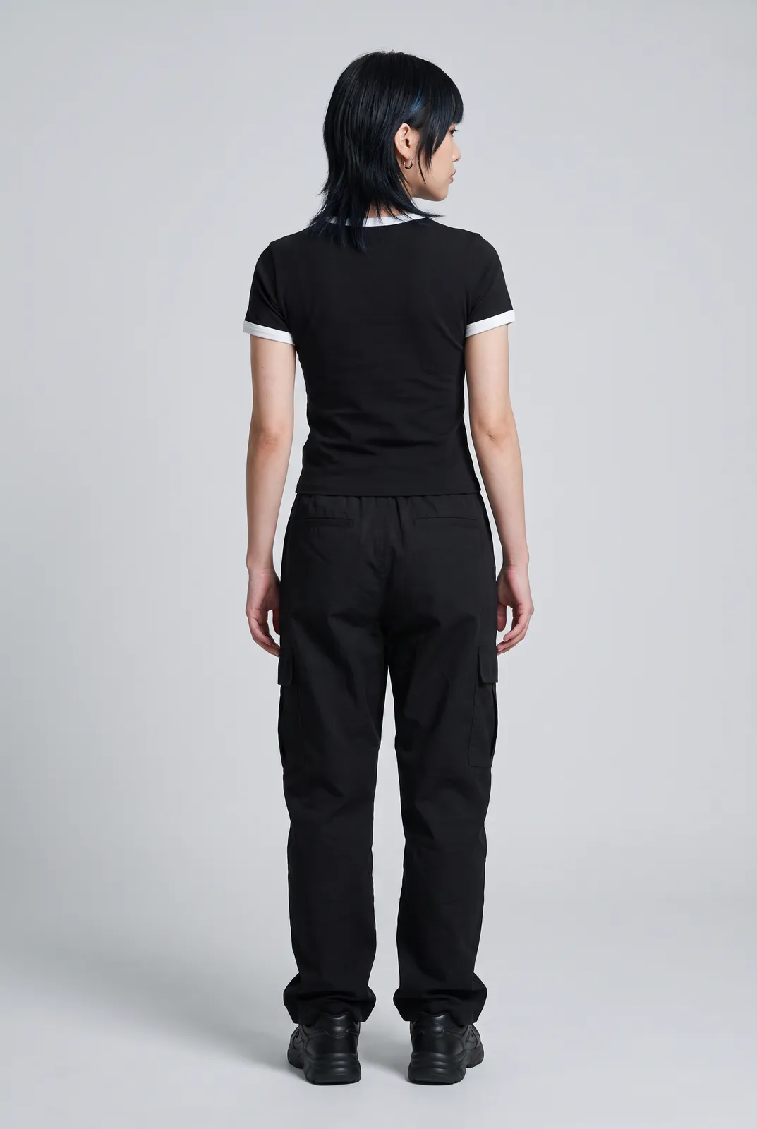 Sora Tanaka wearing the STATIC Baby Tee in Black, back turn