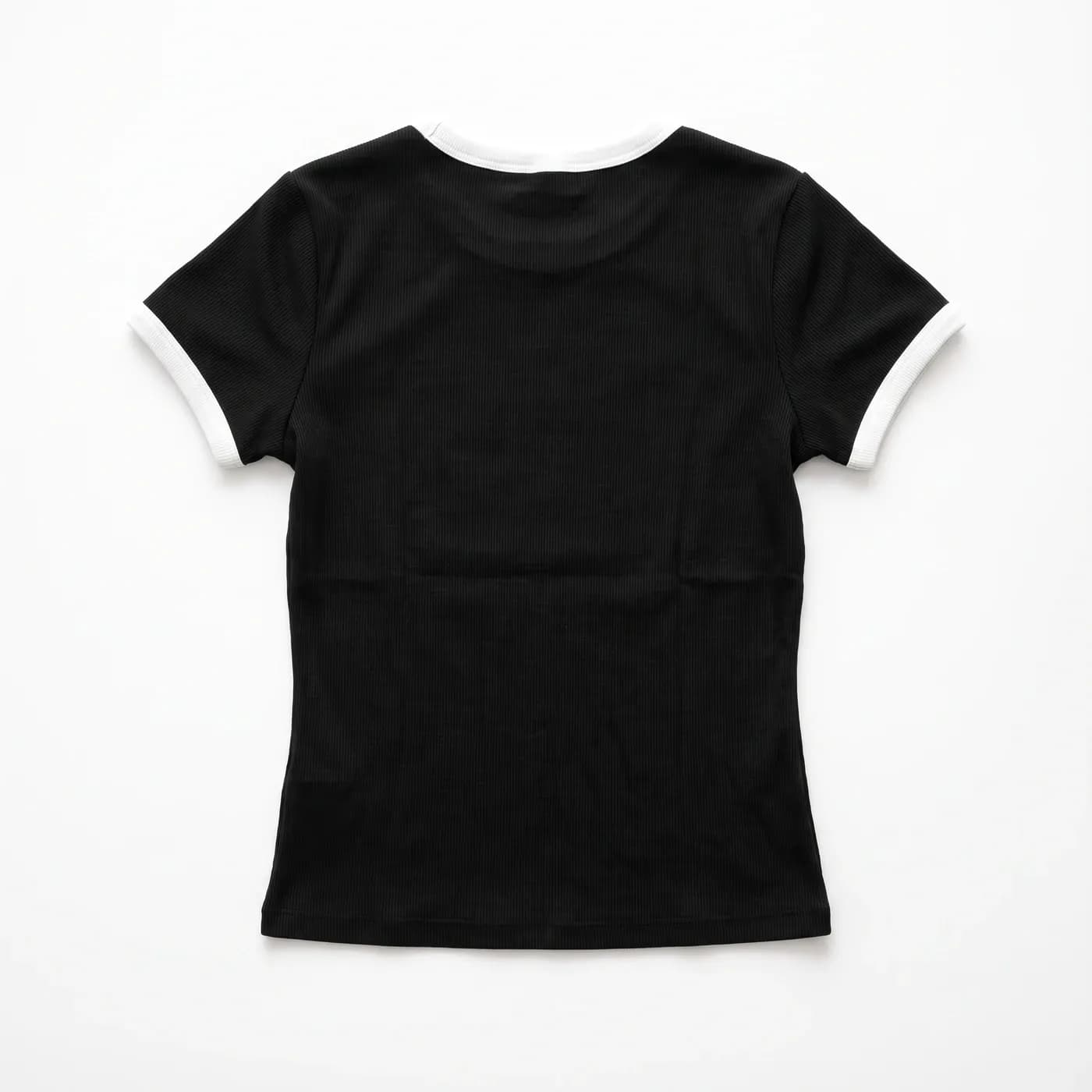 STATIC Baby Tee in Black, laid flat, back