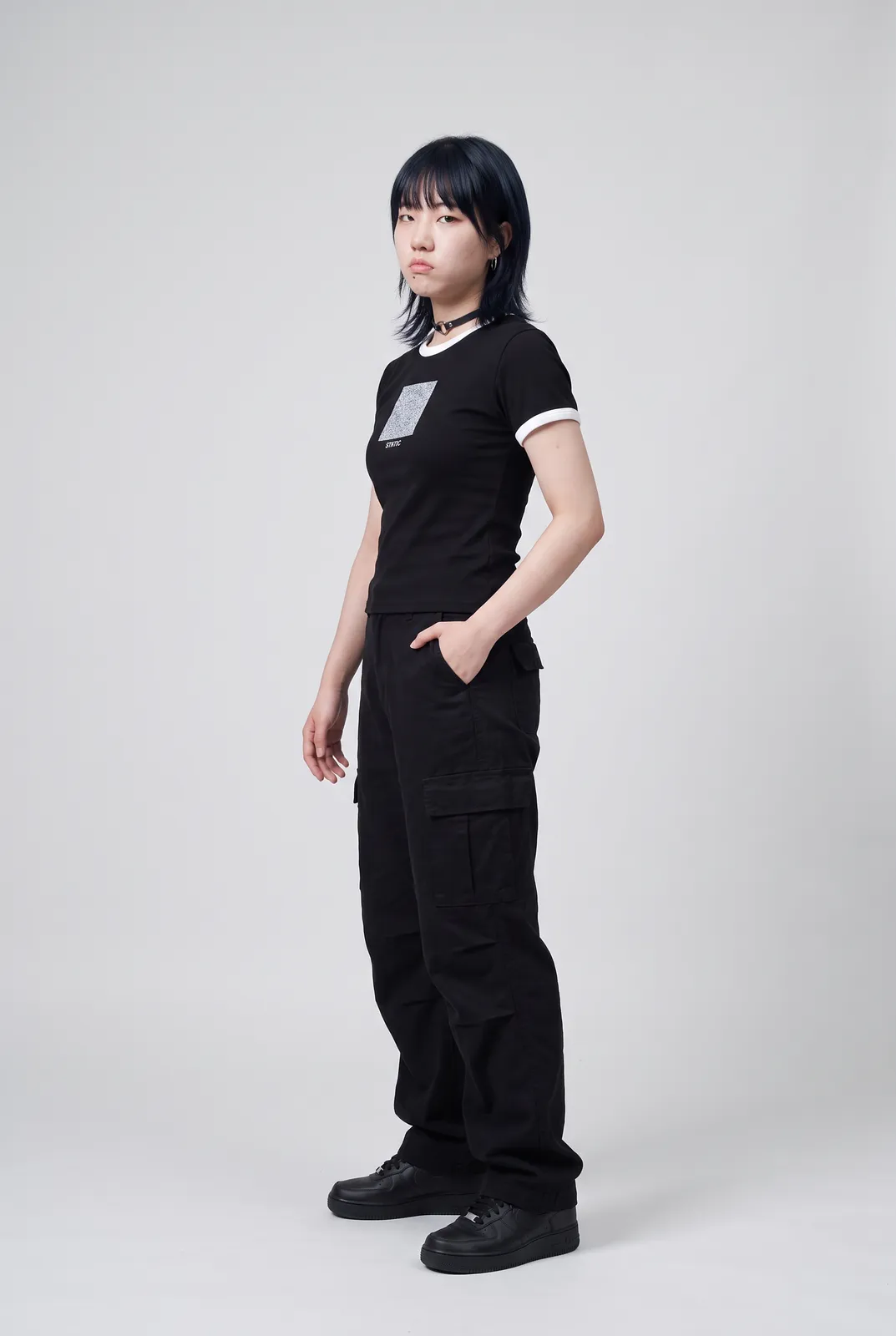 Sora Tanaka wearing the STATIC Baby Tee in Black, three quarter lean